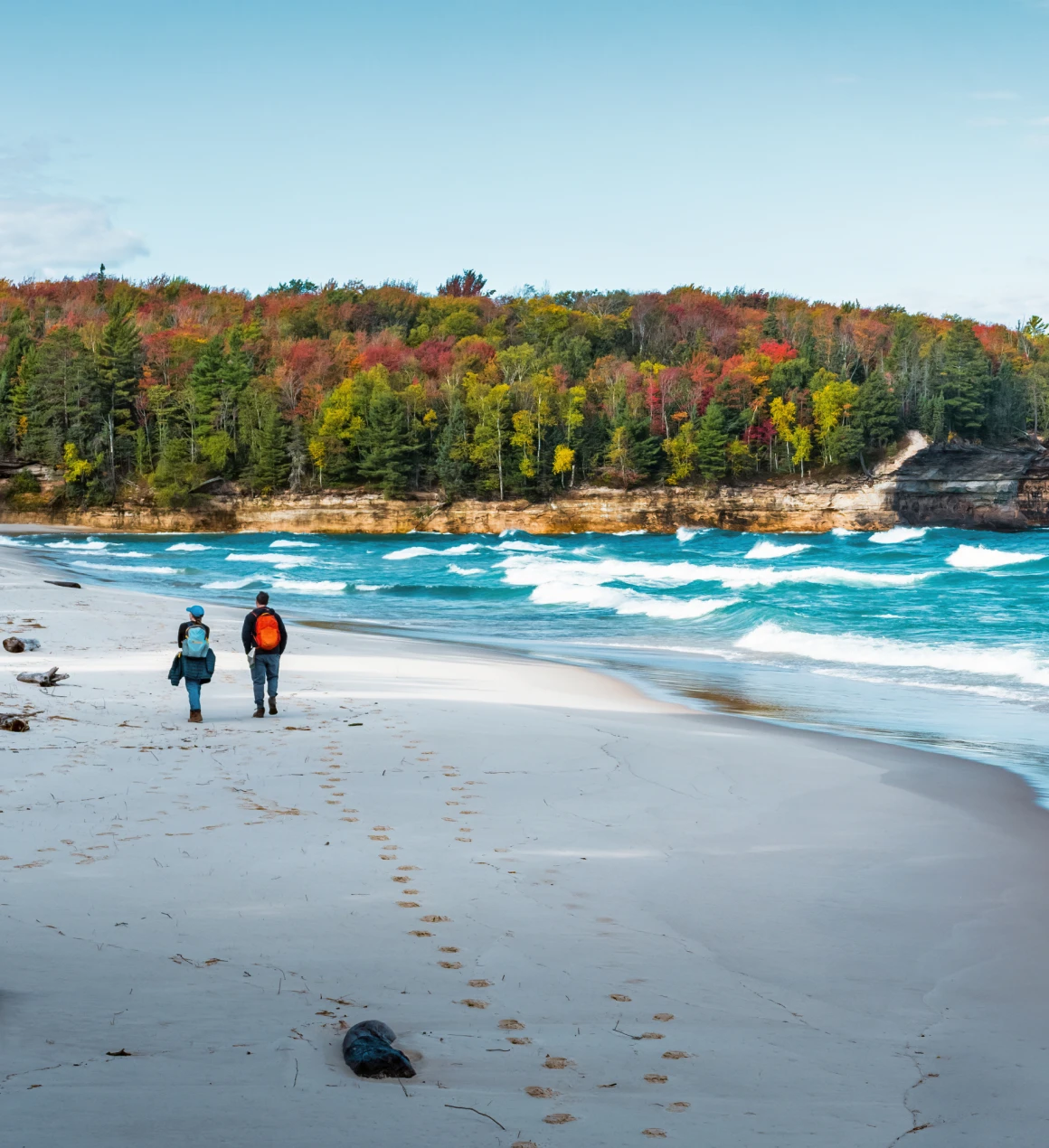 Couple walking on a scenic beach